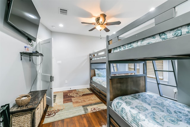 bedroom featuring ceiling fan and dark wood-type flooring