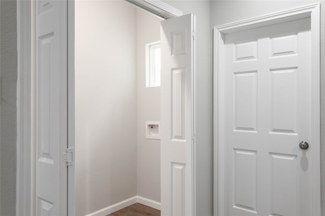 washroom featuring washer hookup and dark hardwood / wood-style floors