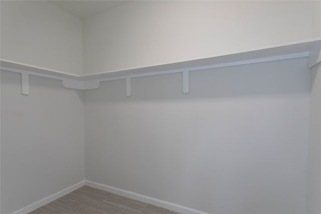 walk in closet featuring light wood-type flooring