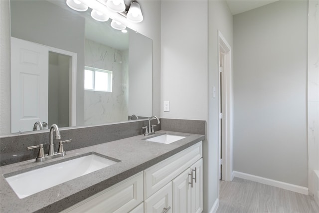 bathroom featuring vanity and walk in shower