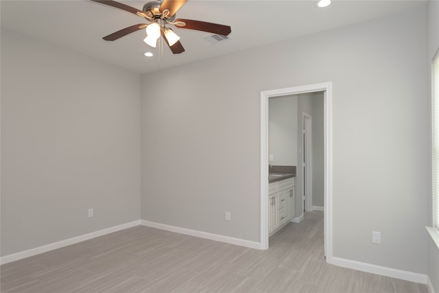 unfurnished room featuring light hardwood / wood-style floors and ceiling fan