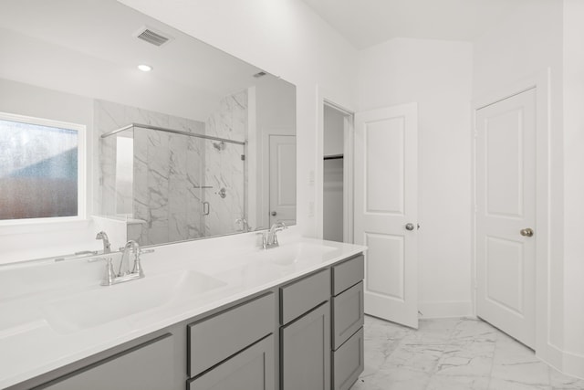 bathroom with vanity and an enclosed shower