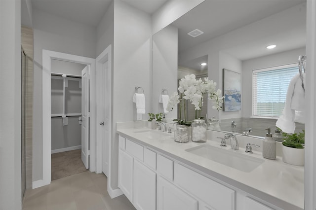 bathroom with tile patterned floors and vanity