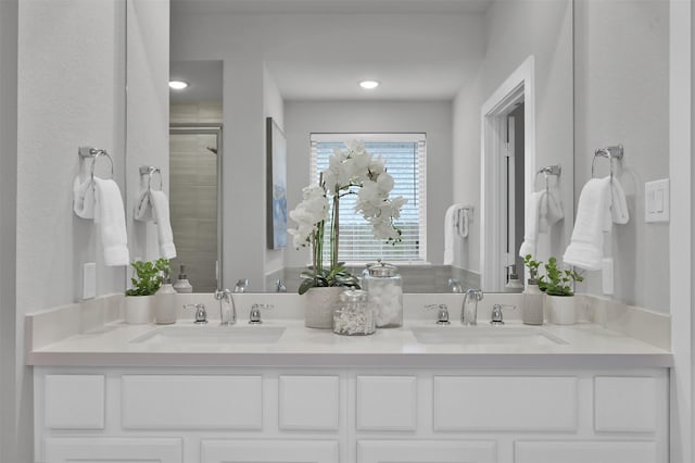 bathroom featuring vanity and an enclosed shower