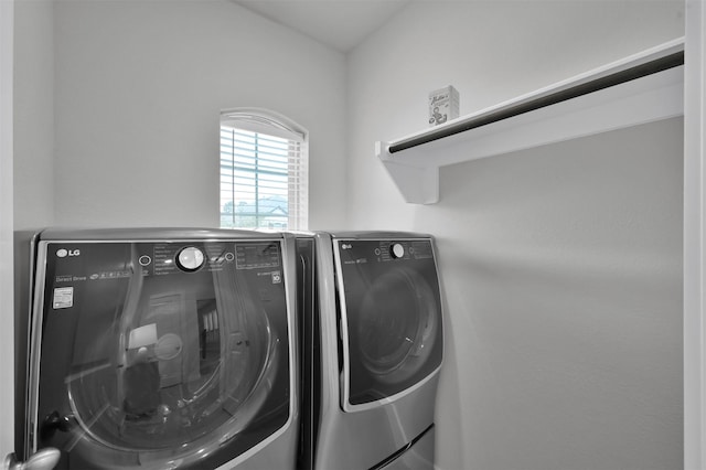 laundry room with independent washer and dryer