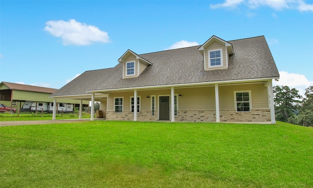 cape cod house with covered porch and a front yard