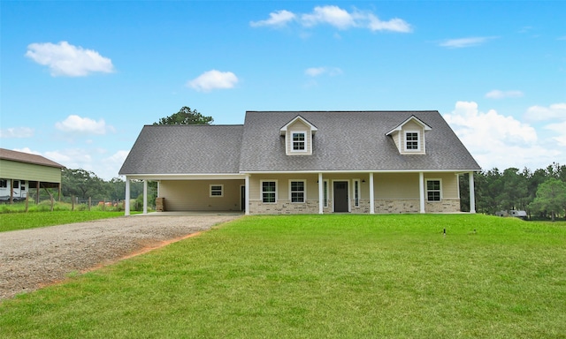 cape cod-style house with a front lawn, a porch, and a carport