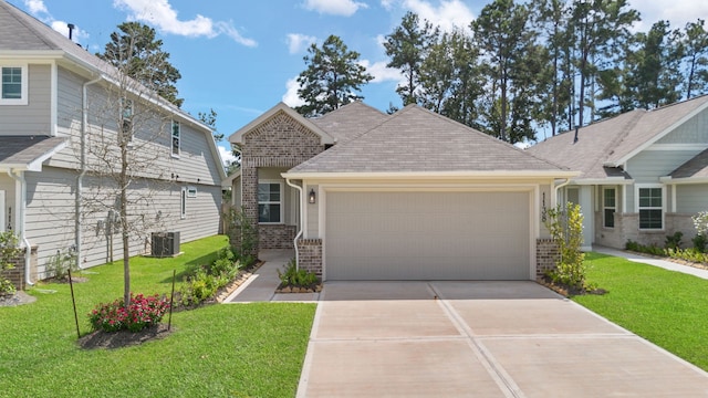 craftsman-style home featuring central AC unit, a garage, and a front lawn