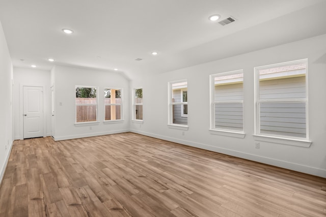 spare room featuring light wood-type flooring