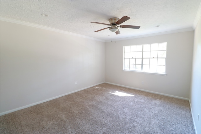 carpeted spare room with ceiling fan, ornamental molding, and a textured ceiling