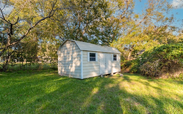 view of outdoor structure with a lawn