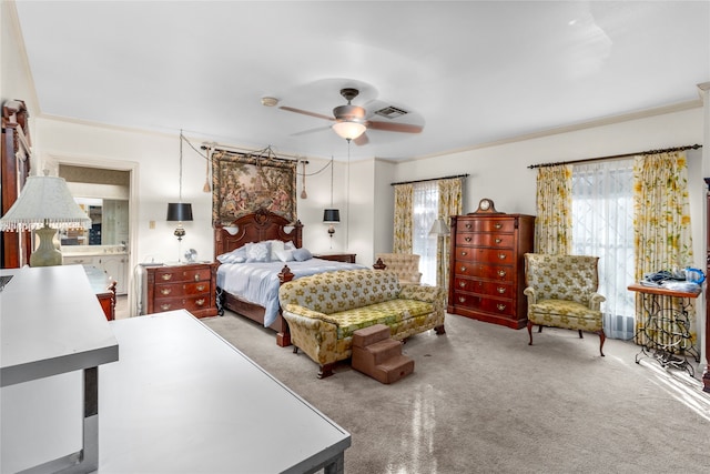 carpeted bedroom with ceiling fan and ornamental molding