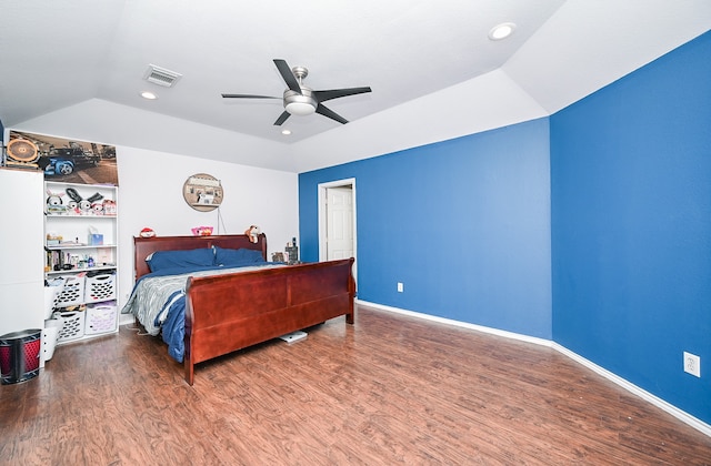 bedroom with ceiling fan, lofted ceiling, and hardwood / wood-style flooring