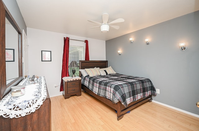 bedroom featuring light wood-type flooring and ceiling fan