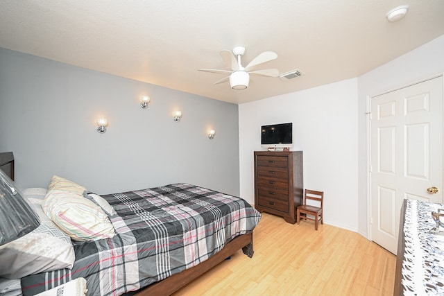 bedroom featuring light wood-type flooring and ceiling fan