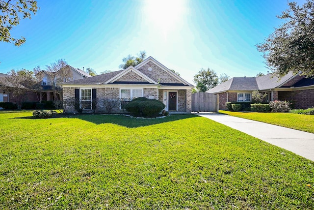 ranch-style home with a front lawn