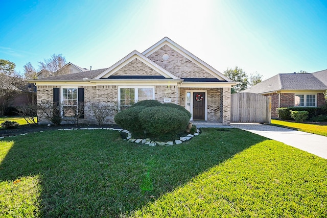 ranch-style home featuring a front yard