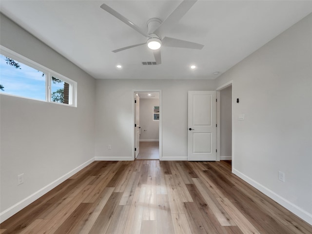 unfurnished room featuring ceiling fan and light hardwood / wood-style floors