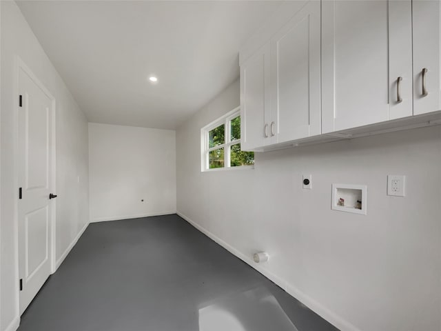 laundry area featuring washer hookup, electric dryer hookup, and cabinets