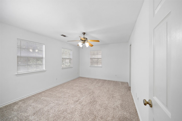 unfurnished room with carpet floors and ceiling fan