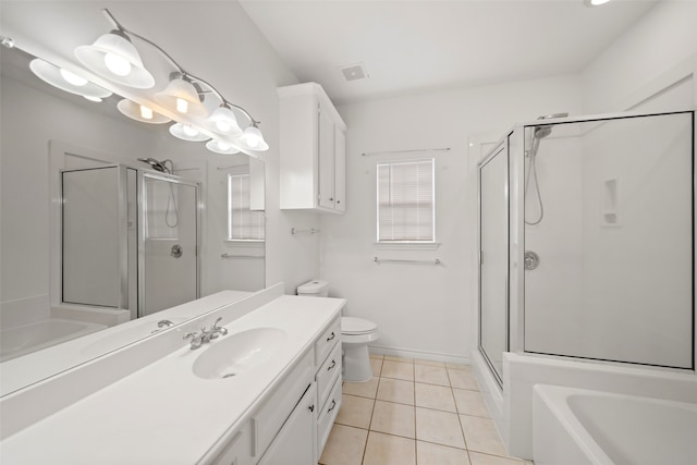 full bathroom with tile patterned flooring, vanity, toilet, and independent shower and bath