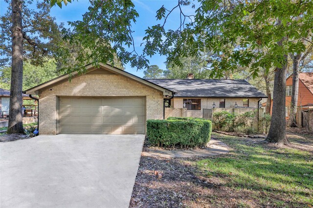 ranch-style house featuring a garage