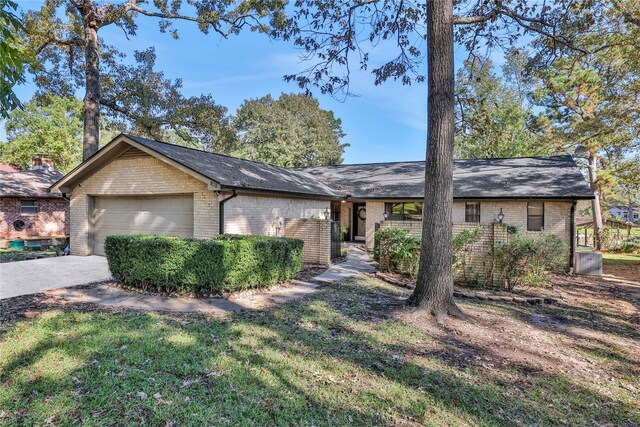 ranch-style house featuring a garage