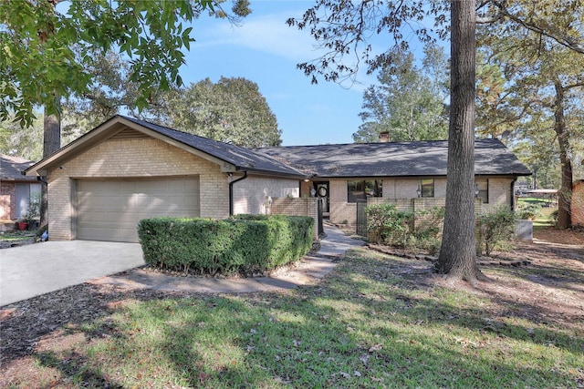 single story home with concrete driveway, an attached garage, brick siding, and a chimney