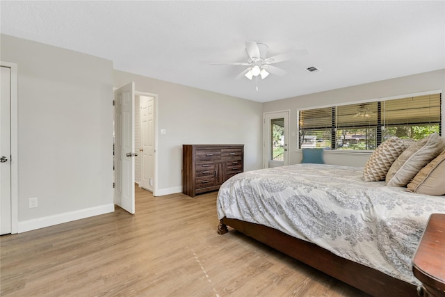 bedroom featuring access to exterior, visible vents, ceiling fan, baseboards, and light wood-type flooring