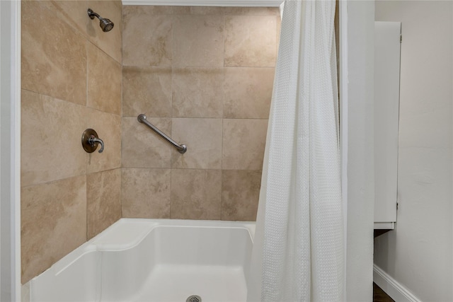 bathroom featuring a shower with curtain