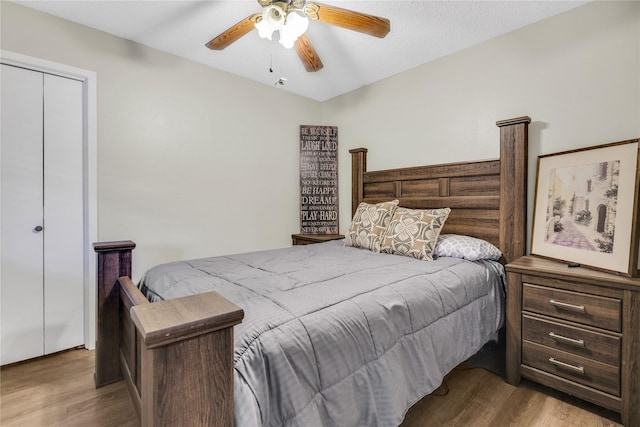 bedroom with a ceiling fan and wood finished floors