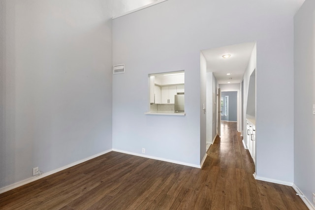 corridor featuring dark hardwood / wood-style floors