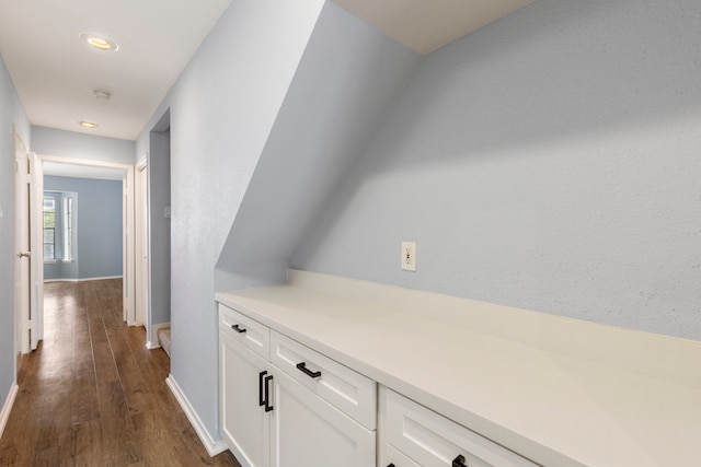 corridor featuring dark wood-type flooring