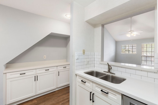 kitchen with sink, dark hardwood / wood-style floors, ceiling fan, decorative backsplash, and white cabinetry