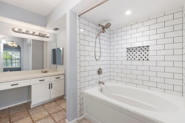 bathroom with vanity and tiled shower / bath combo