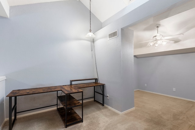 office area featuring ceiling fan, light colored carpet, and lofted ceiling