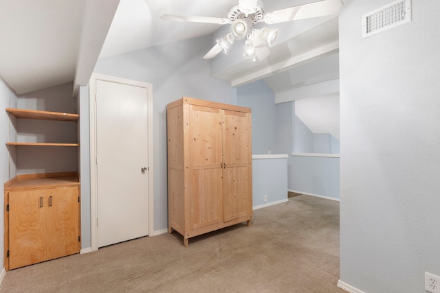 additional living space featuring ceiling fan, light colored carpet, and lofted ceiling