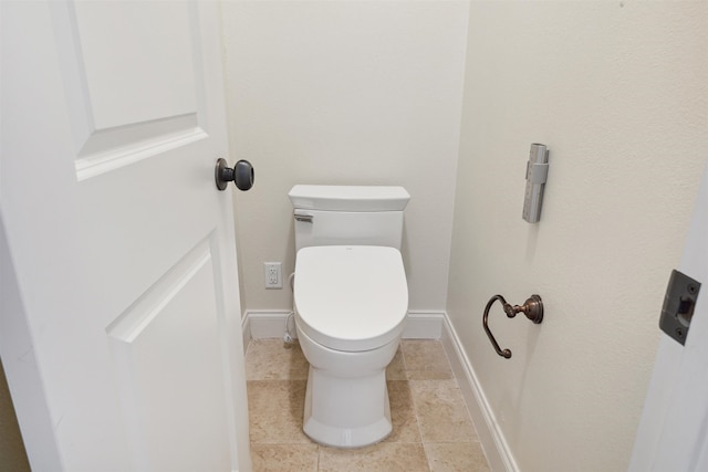 bathroom featuring tile patterned floors and toilet