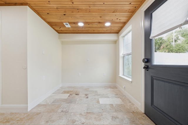 doorway to outside with wood ceiling