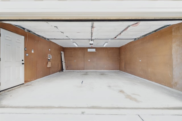 garage featuring wooden walls