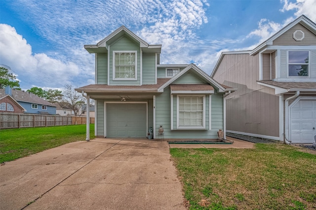 view of front of home with a garage and a front yard