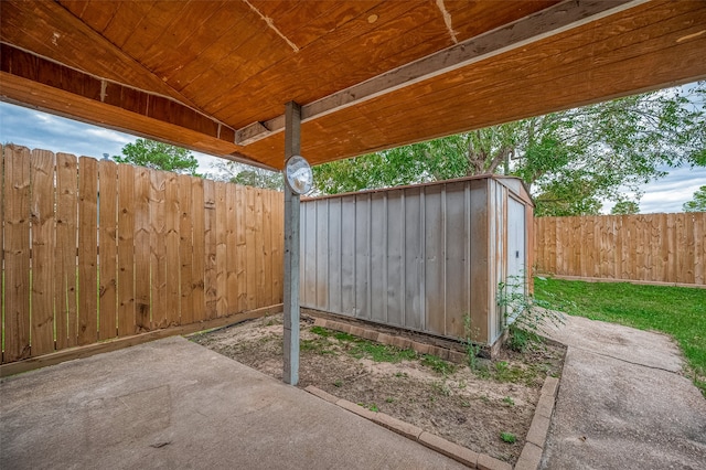 view of patio / terrace with a storage shed