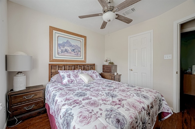 bedroom featuring dark hardwood / wood-style flooring and ceiling fan