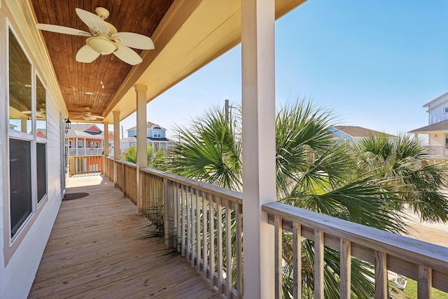 wooden terrace featuring ceiling fan