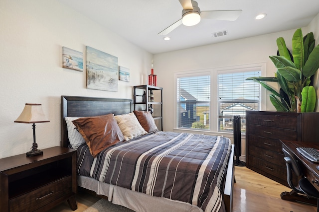 bedroom with ceiling fan and light wood-type flooring