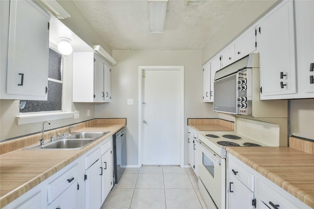 kitchen featuring white electric range, sink, stainless steel dishwasher, light tile patterned floors, and white cabinetry