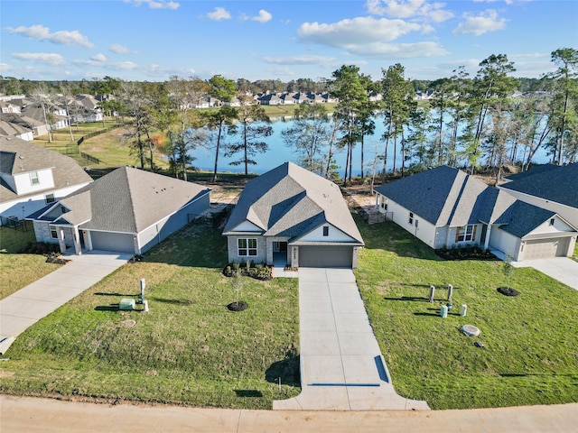 birds eye view of property with a water view