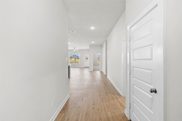 corridor featuring light hardwood / wood-style flooring