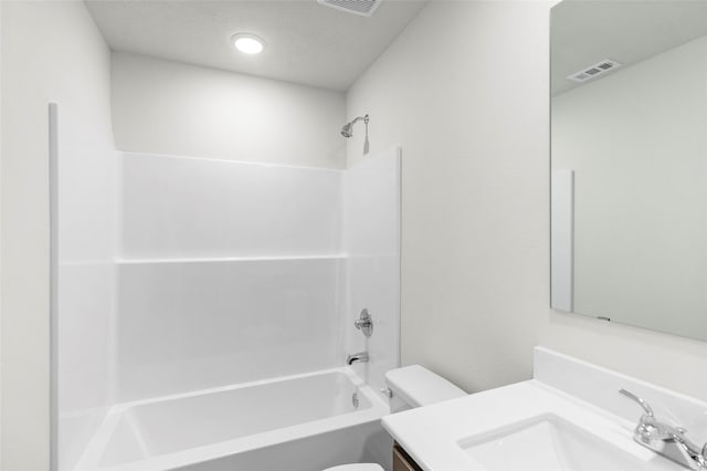 full bathroom featuring vanity, toilet, and  shower combination