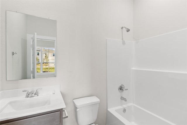 full bathroom featuring vanity, shower / bath combination, and toilet